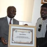 meiway-fait-citoyen-d-honneur-de-la-ville-de-grand-bassam-par-le-maire-jean-louis-moulot