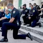 etats-unis-des-policiers-americains-s-agenouillent-entre-geste-de-solidarite-et-desescalade